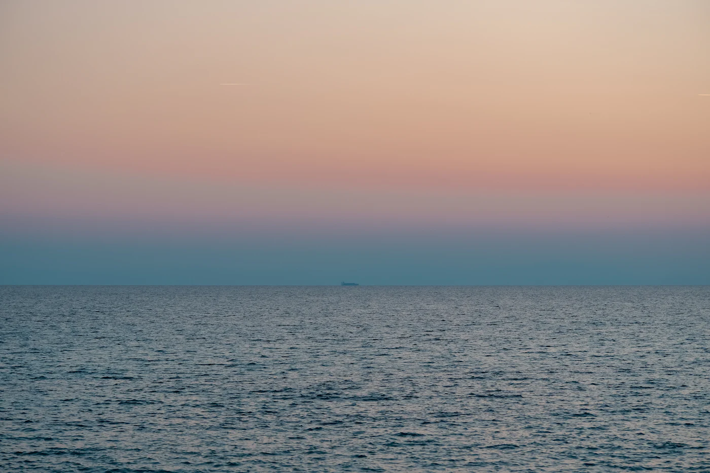 The Mediterranean at dusk, pastel sky over calm water