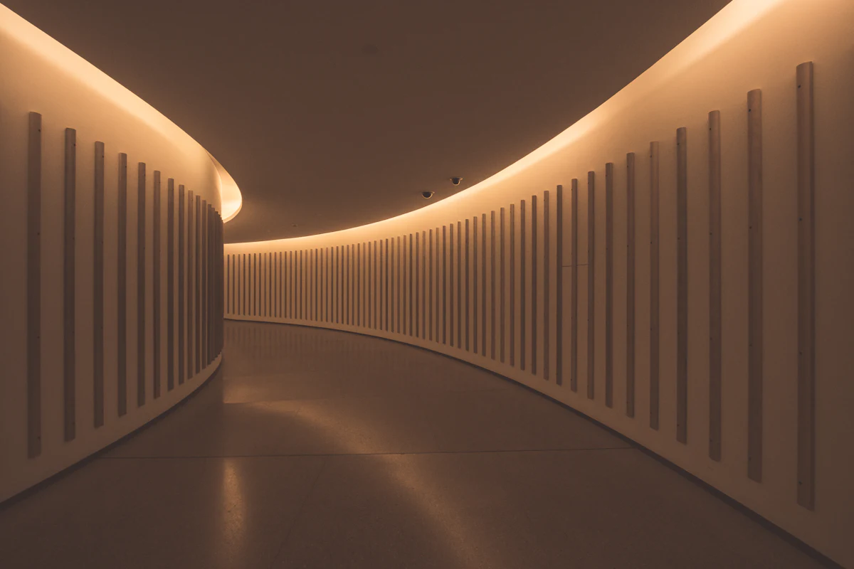 Warm sculpted corridor with soft light